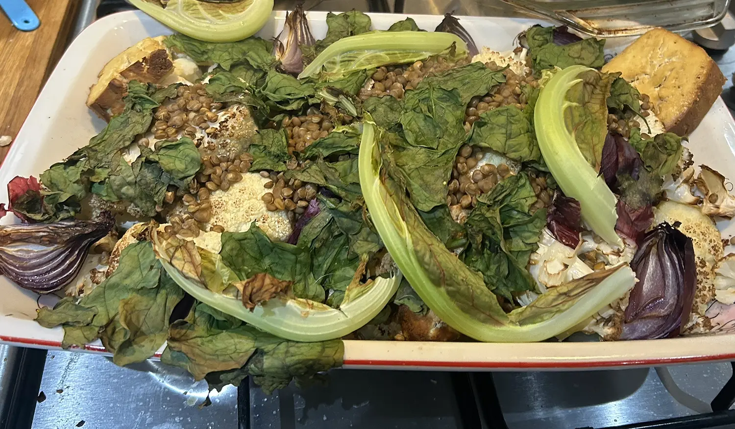 Over tray with roasted cauliflower, green lentils, tofu and onion.